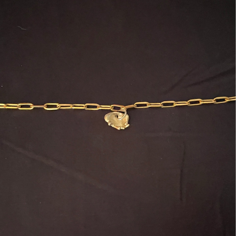 Alice made this gold charm bracelet